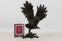 A bronze avian study entitled The Great Horned Owl by George McMonigle, issued by Franklin Mint,