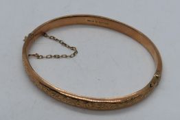 A 9 carat rose gold bangle stamped 9; .375, approx 5.