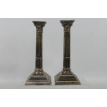 A pair of silver Corinthian column candlesticks, Birmingham assay 1957,