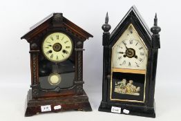 A pair of interesting kitchen shelf clocks, both with alarm feature and glazed doors,