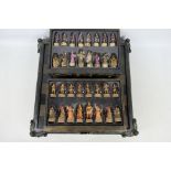 A fantasy themed chess set with 9 cm (h) king.