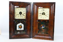 An interesting pair of late 19th century/ early 20th century 30-hour weight driven American ogee