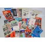 A box of various football programmes, in excess of 100.