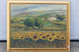 A large oil on canvas landscape scene depicting fields of sunflowers,