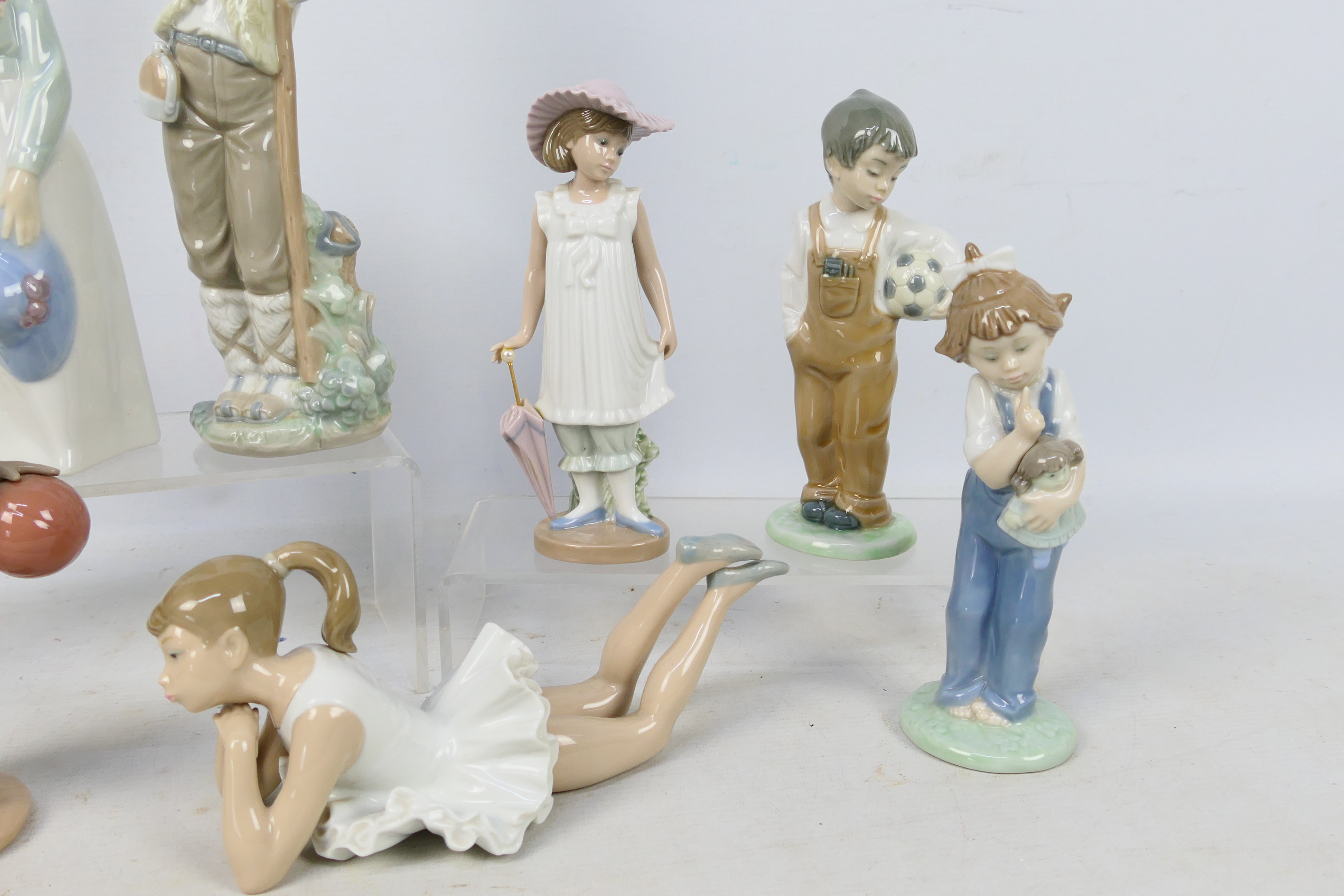 Eight Nao figures depicting children, largest approximately 27 cm (h). - Image 3 of 5