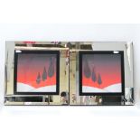 A pair of decorative wall art pictures with mirrored frames, approximately 62 cm x 61 cm.