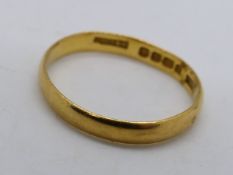 A hallmarked 22 carat gold ring, approx 2.