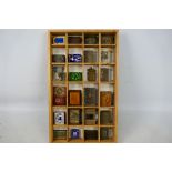 A collection of vintage matchbox covers to include a Chinese cloisonne example, ceramic, brass,