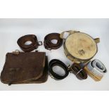 Lot to include military belts, canvas and leather pouch and a water canteen.
