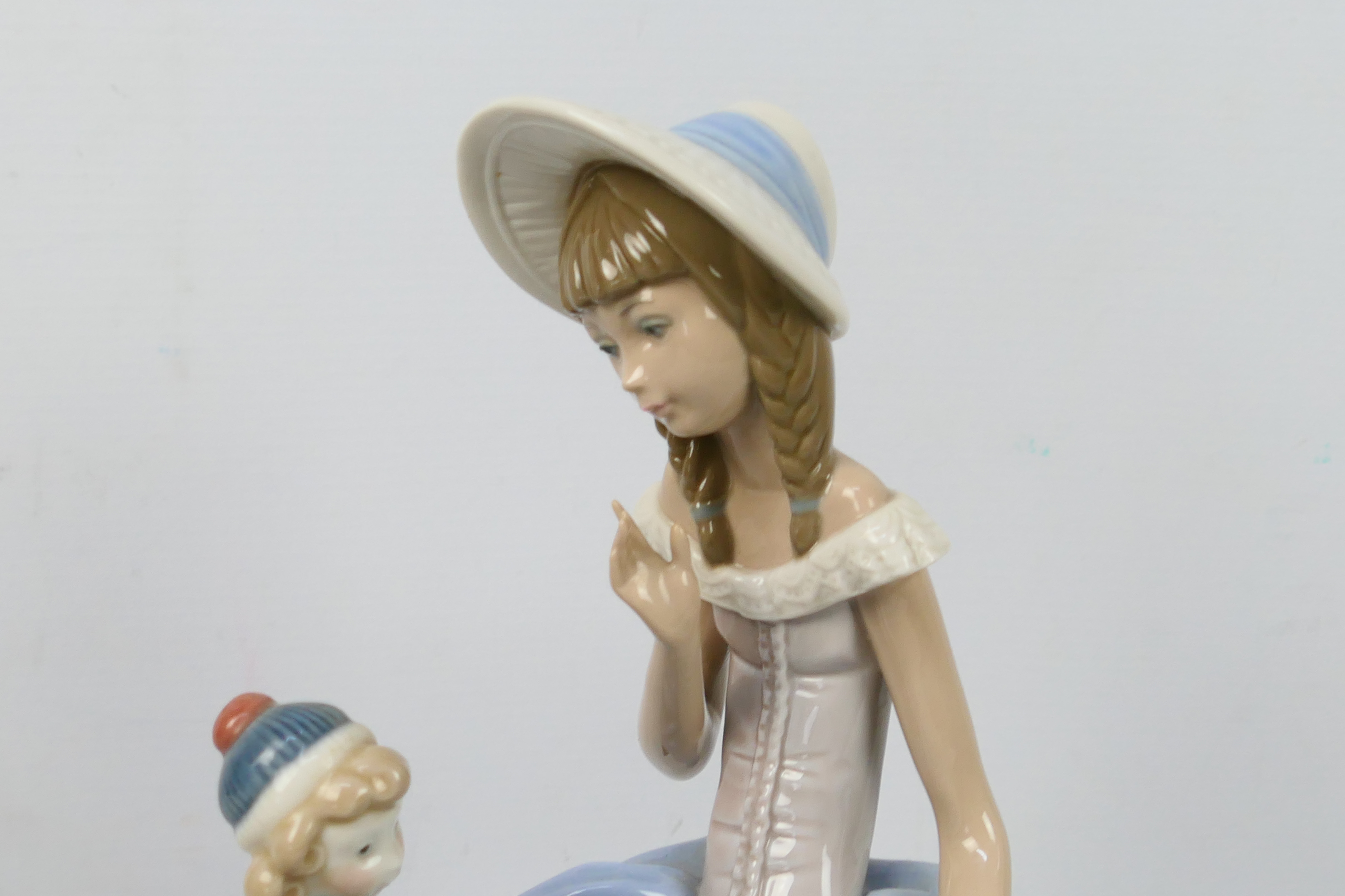 Lladro - A figural group entitled Suzy And Her Doll # 1378, approximately 28 cm (h). - Image 3 of 5