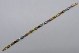 A 9ct yellow gold, stone set line bracelet, 19 cm (l), approximately 6.8 grams all in.
