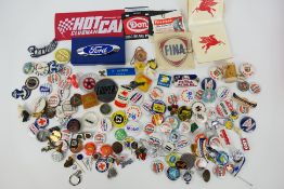 A good collection of pin badges and similar to include many motoring / car related examples,
