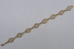 A 9ct yellow gold filigree bracelet, 20 cm (l), approximately 5.5 grams all in.