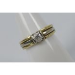 A mid-purity two-tone, solitaire ring, stamped Altinbas 585 for 14ct, size K, approximately 3.