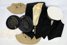 Naval cap with HMS Daedalus tally, waistcoats, RAF beret and other.