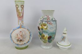 Two glass vases with hand painted decoration, one with a panel of putti with foliate surround,
