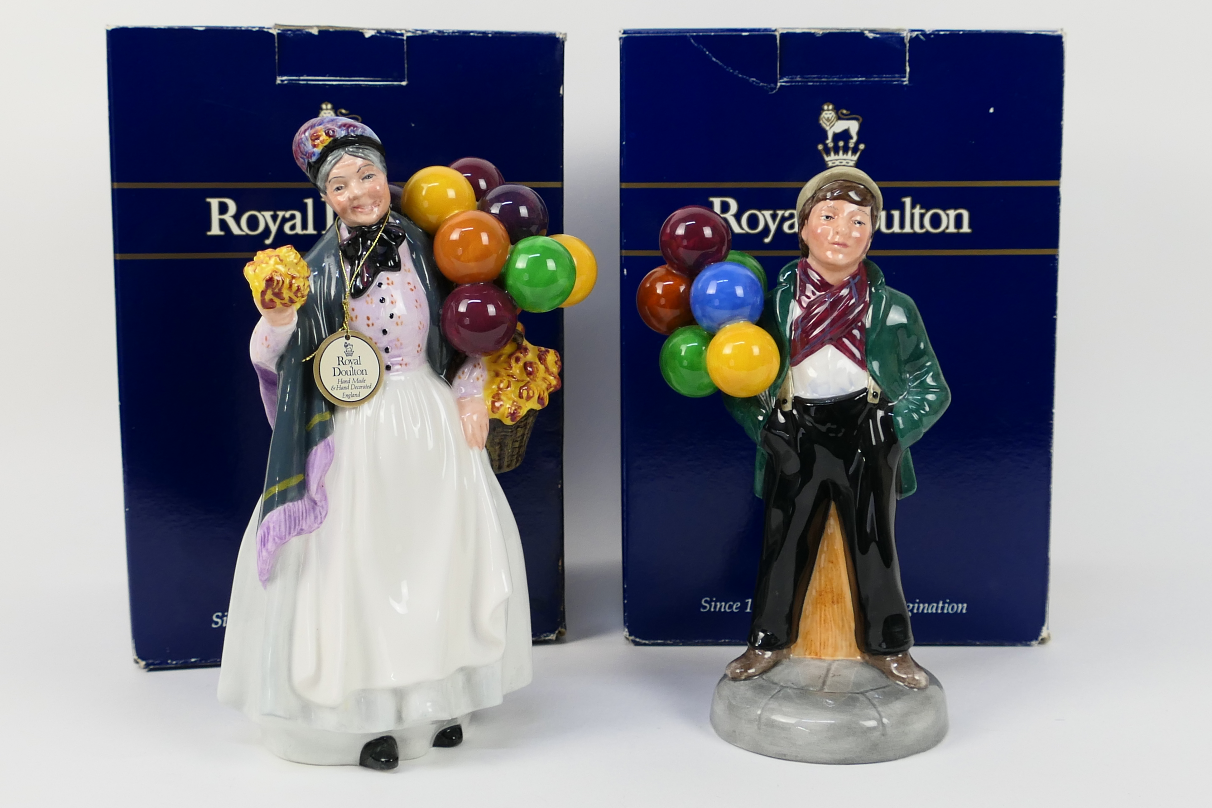 Royal Doulton - Two boxed figures comprising Biddy Penny Farthing # HN1843 and Balloon Boy # HN2934,