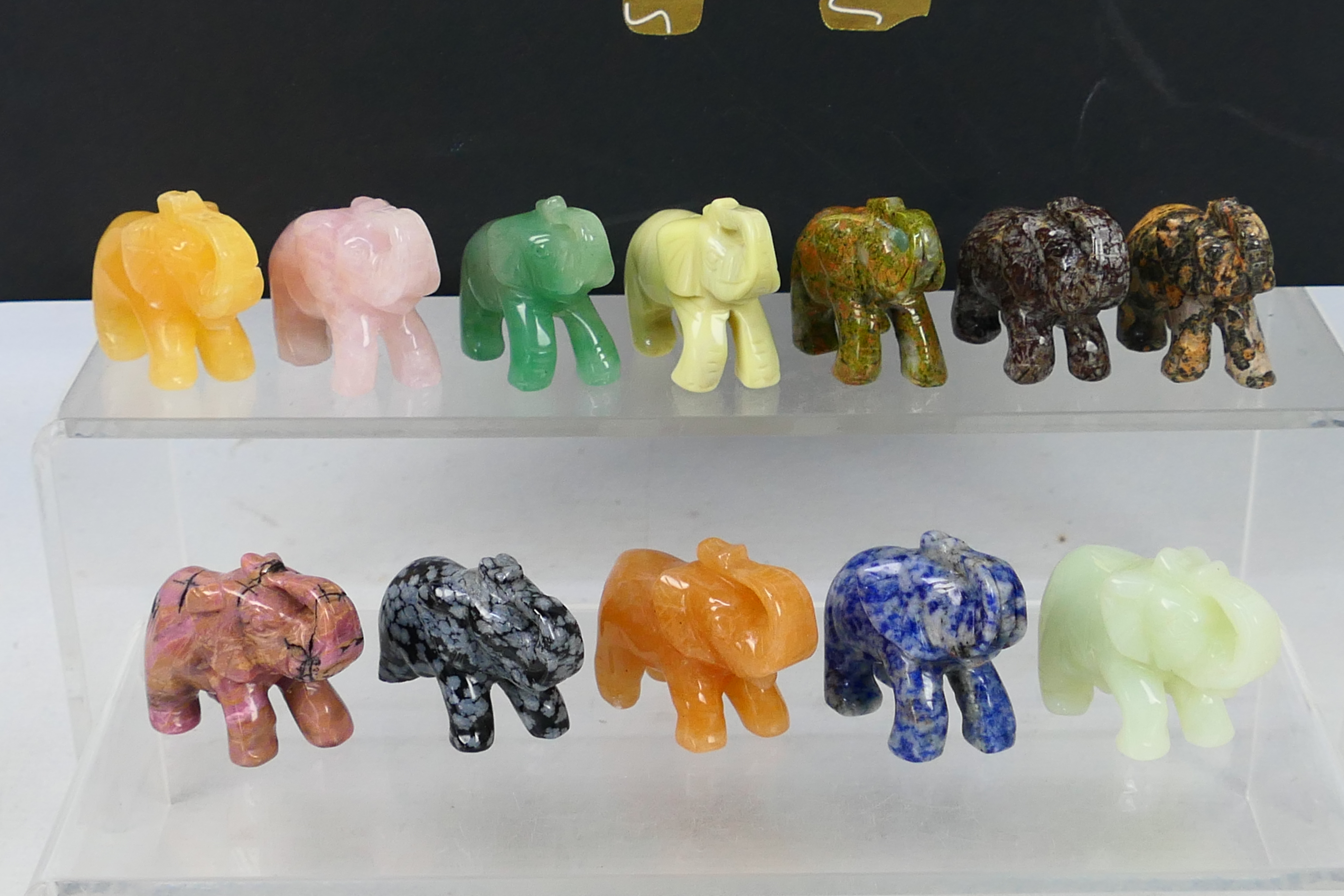 A collection of twelve carved elephants, each carved from a different hardstone, - Image 2 of 7