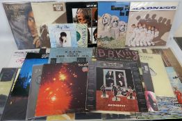 A collection of 12" vinyl records to include Blondie, Fleetwood Mac, Madness, The Kinks, The Who,