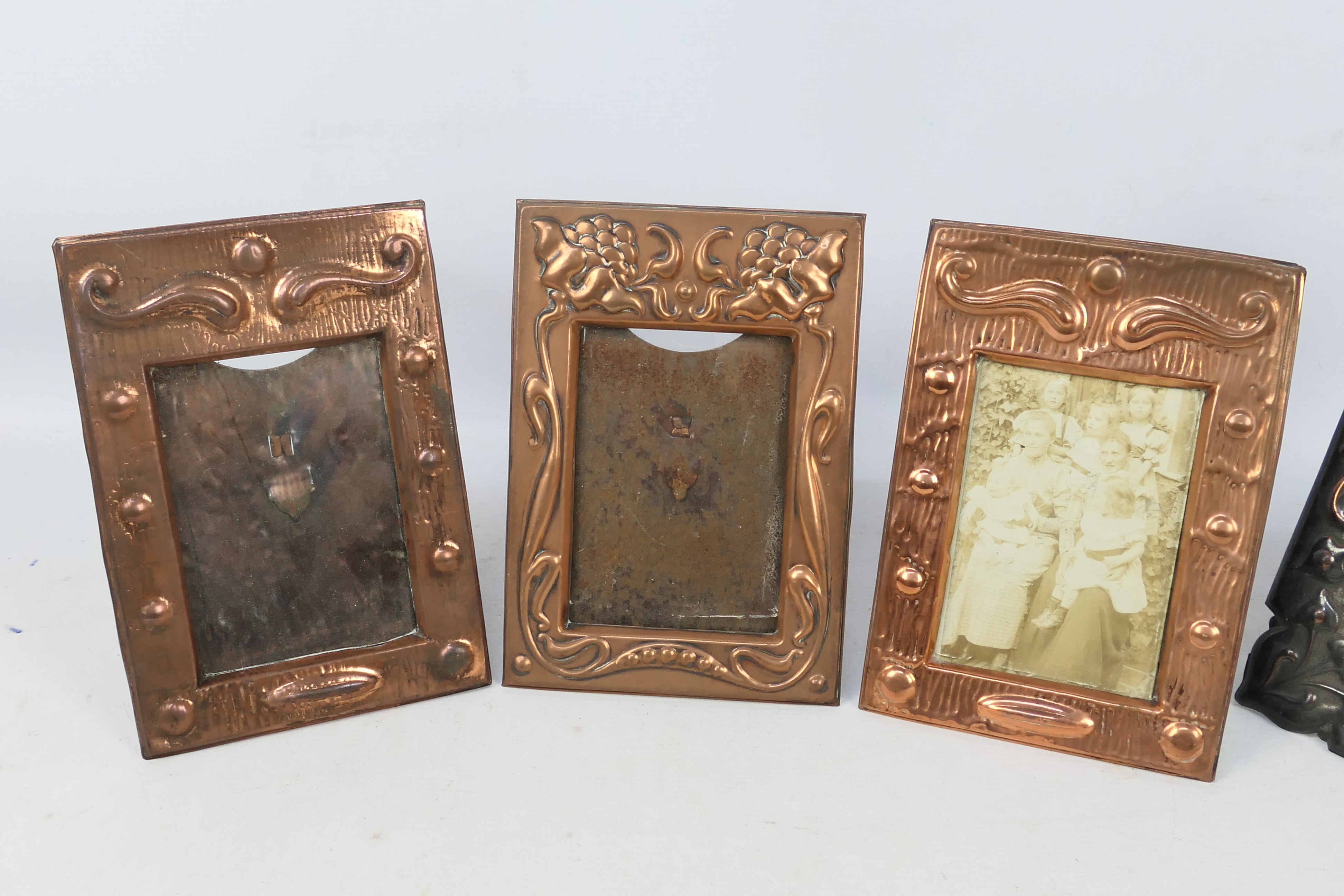 Four copper framed, easel back photograph frames including Art Nouveau style. - Image 2 of 4