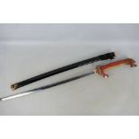 Decorative Japanese style sword with dragon form hilt,