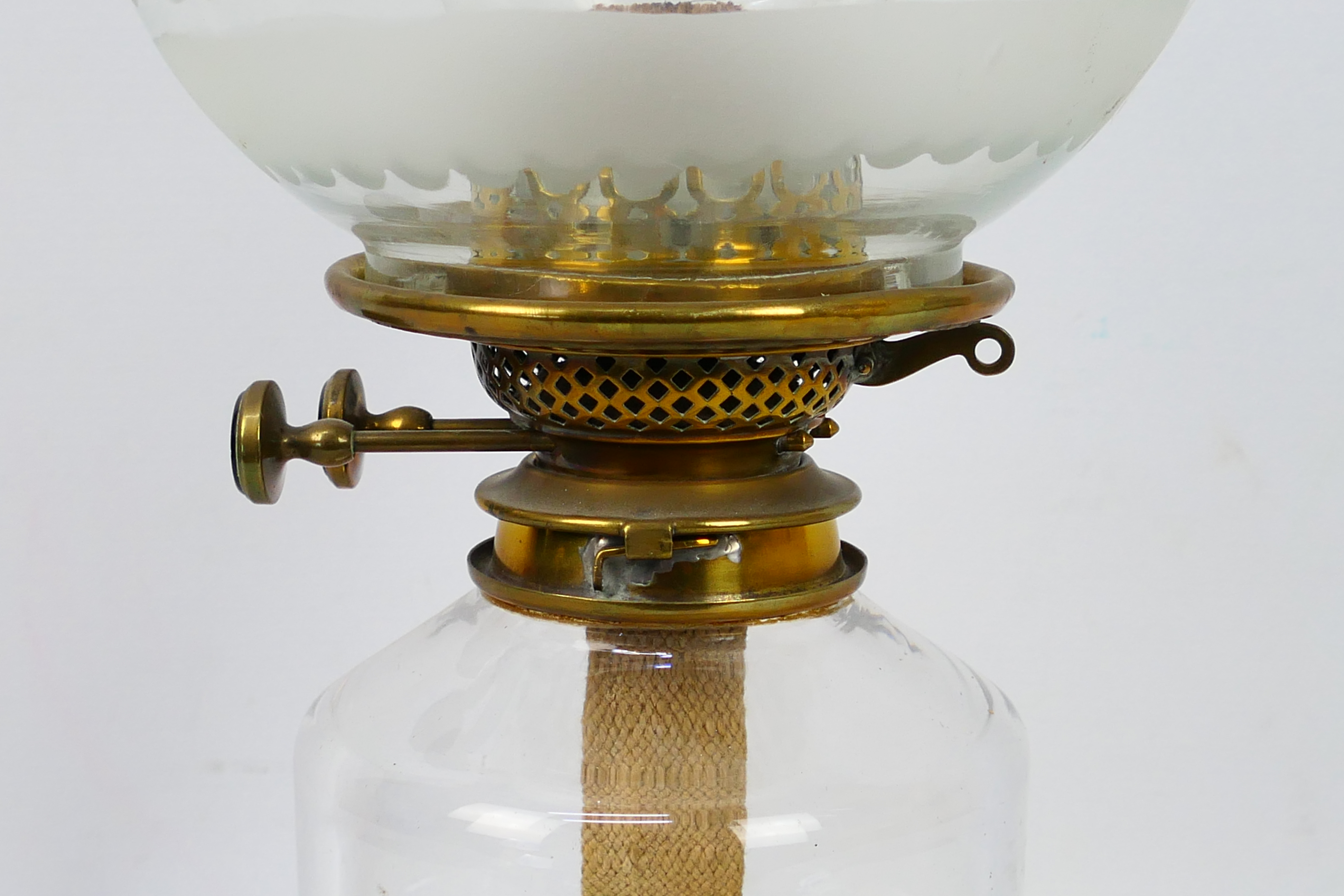 A heavy glass oil lamp with star cut base and clear glass shade, approximately 50 cm (h). - Image 3 of 4