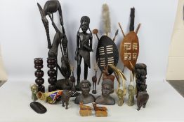 Ethnographica - A collection of tribal carvings, ornamental displays and similar.