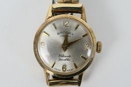 A 9ct gold cased lady's wrist watch on rolled gold expanding bracelet, 16.3 grams all in.