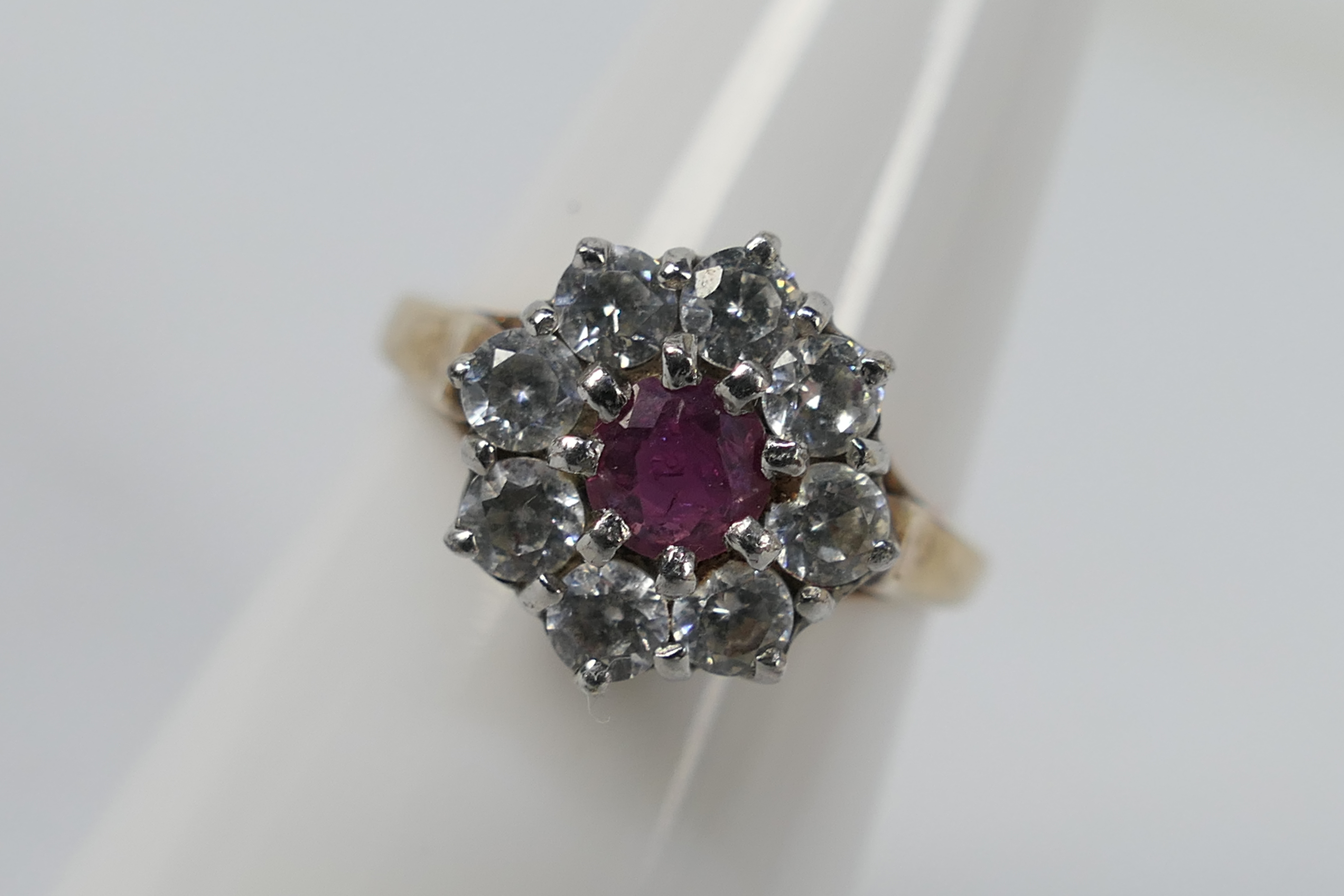 A 9ct yellow gold ruby and cz cluster ring, size M, approximately 3.4 grams all in.