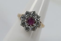 A 9ct yellow gold ruby and cz cluster ring, size M, approximately 3.4 grams all in.