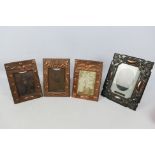 Four copper framed, easel back photograph frames including Art Nouveau style.