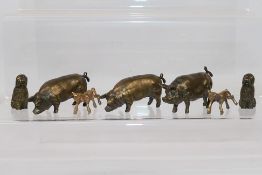 8 x bronze dog, pig, and goat figures. All in similar sizes. Largest is 5 cm (l).