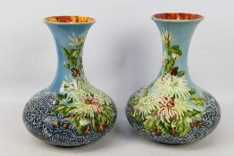 A large pair of hand painted Royal Faience vases, approximately 32 cm (h).