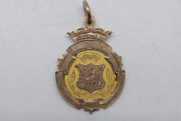 A 9ct gold sporting medal for St Leonards U.F.C Winners Div II 1905-06, approximately 6.9 grams.