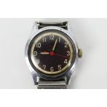 A military style Swiss wrist watch with black dial and white Arabic numerals,