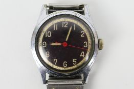 A military style Swiss wrist watch with black dial and white Arabic numerals,