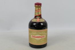 A vintage bottle of Drambuie, no capacity or strength stated, likely a 1970's bottling.