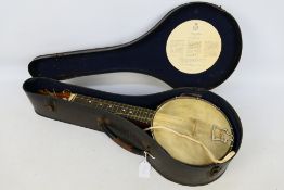 A vintage John Grey & Sons, London banjolele, contained in case.