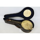 A vintage John Grey & Sons, London banjolele, contained in case.