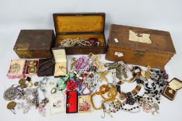 Three wooden boxes containing a quantity of costume jewellery and similar including a silver fob,