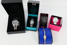 A collection of boxed fashion wrist watches.