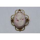 A yellow metal, stamped 9ct, openwork mount cameo brooch, 7.2 grams all in.