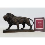 Franklin Mint - A 'Lion Qui Marche' bronze lion statue by Antoine-Louis Barye -.