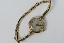 A 9ct gold cased lady's wrist watch on expanding bracelet marked 9ct Gold Metal Core,