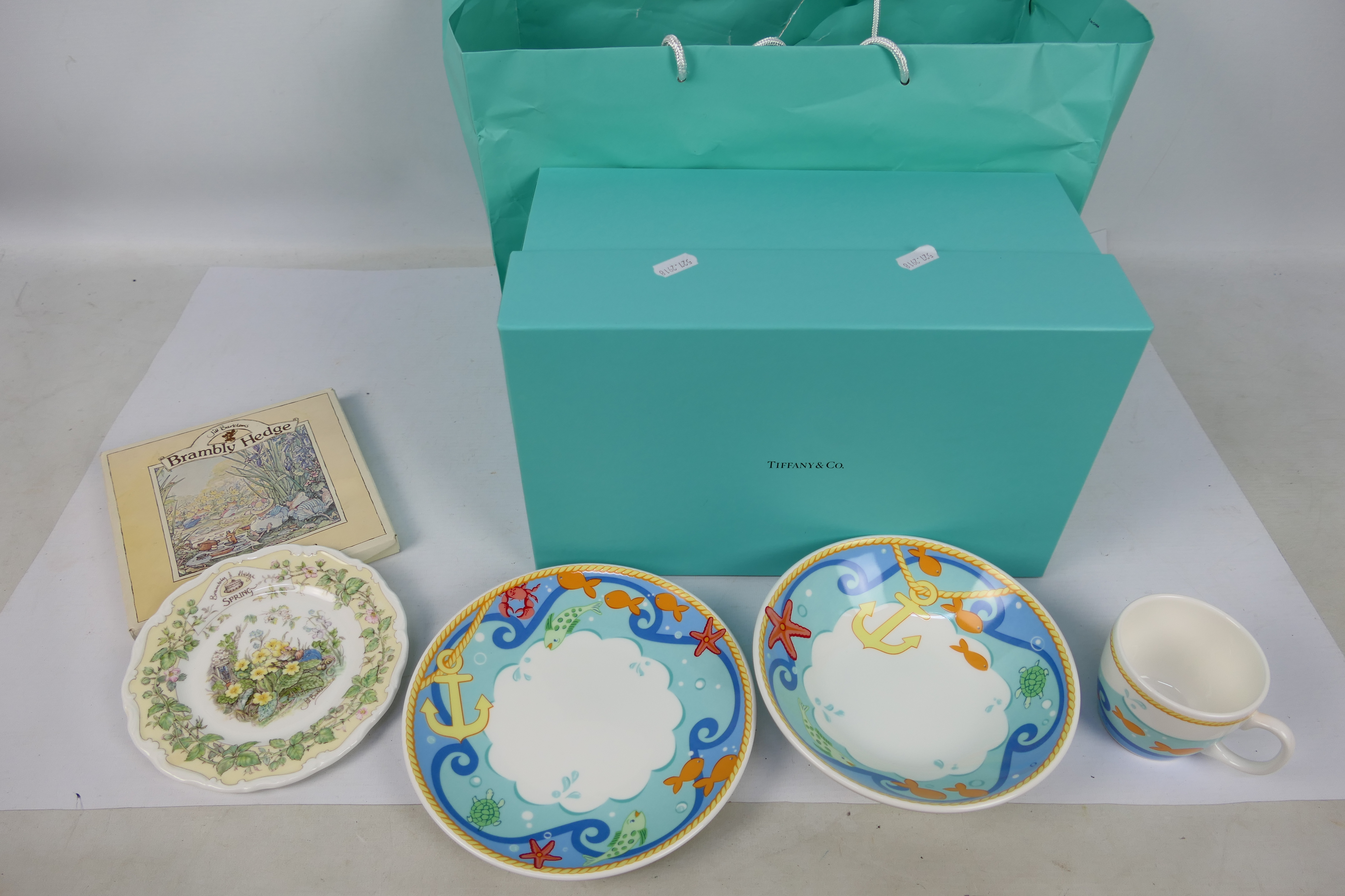 A Tiffany three piece breakfast set contained in original box and a boxed Royal Doulton Brambly