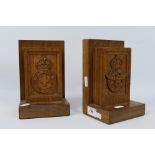 A pair of bookends one with carved Red Cross Society badge, the other with RAF,