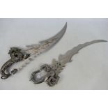 Two decorative Fantasy blades with dragon form hilts, approximately 55 cm (l).