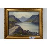 Edward Horace Thompson (1879-1949) - A lakeside watercolour landscape scene,