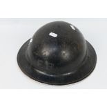 A World War Two (WW2 / WWII) Brodie helmet, black painted finish and marked FB,