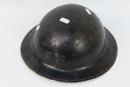 A World War Two (WW2 / WWII) Brodie helmet, black painted finish and marked FB,